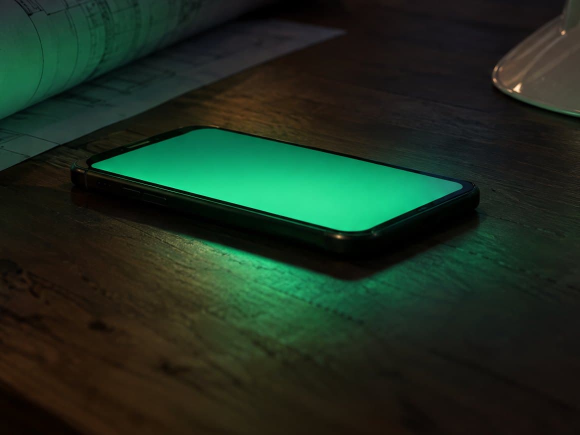 A phone on a site desk lighting up with a quote request that has just been answered